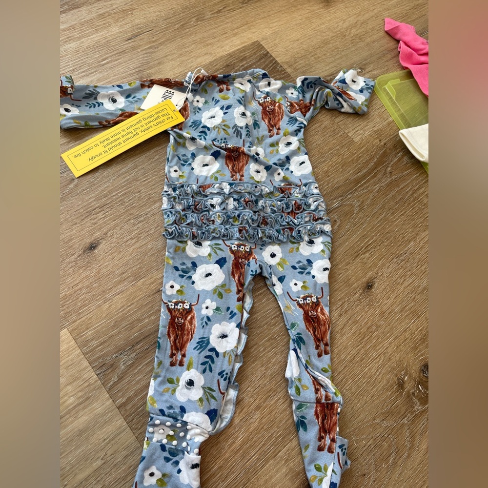 Blue highland cow ruffled onesie. Brand new with tags. 0-3 months. Super soft!